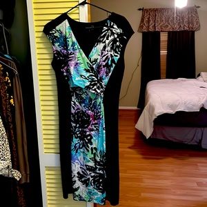 Worn once to wedding. Machine washable.